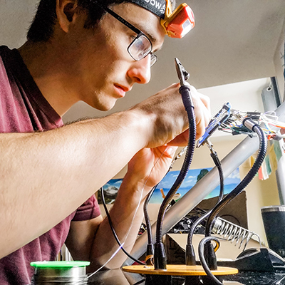 student working on a computer device